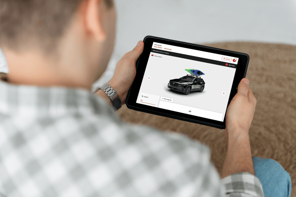 Person Holding iPad Mockup at Home_2026Mazda