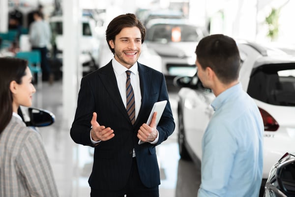 car salesman and customers
