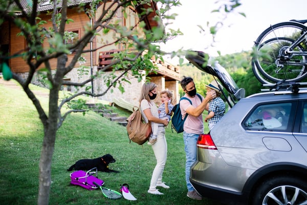 family-with-two-small-children-dog-and-face-masks--PKVMW6M