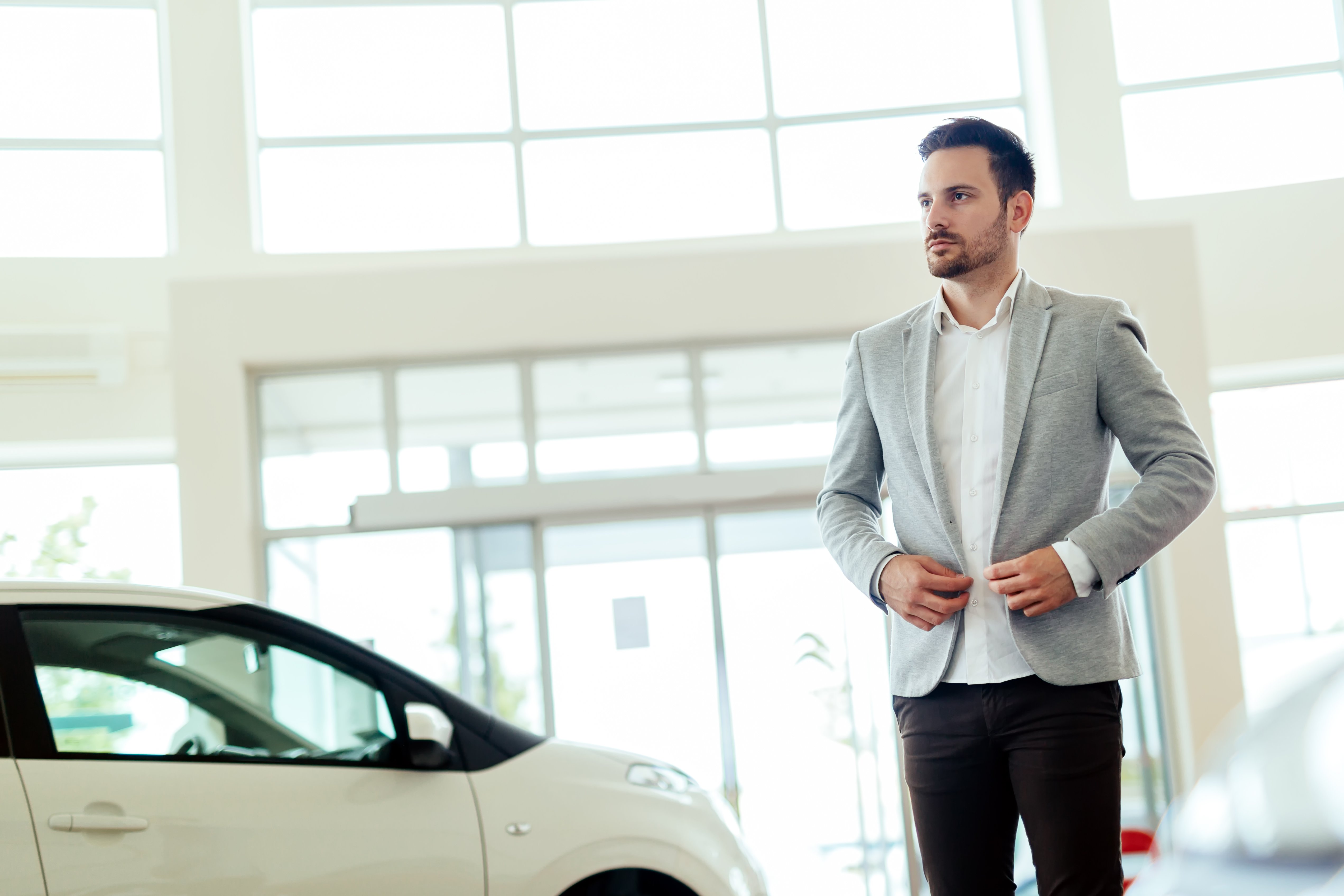 salesperson-at-car-dealership-2021-08-26-17-31-12-utc