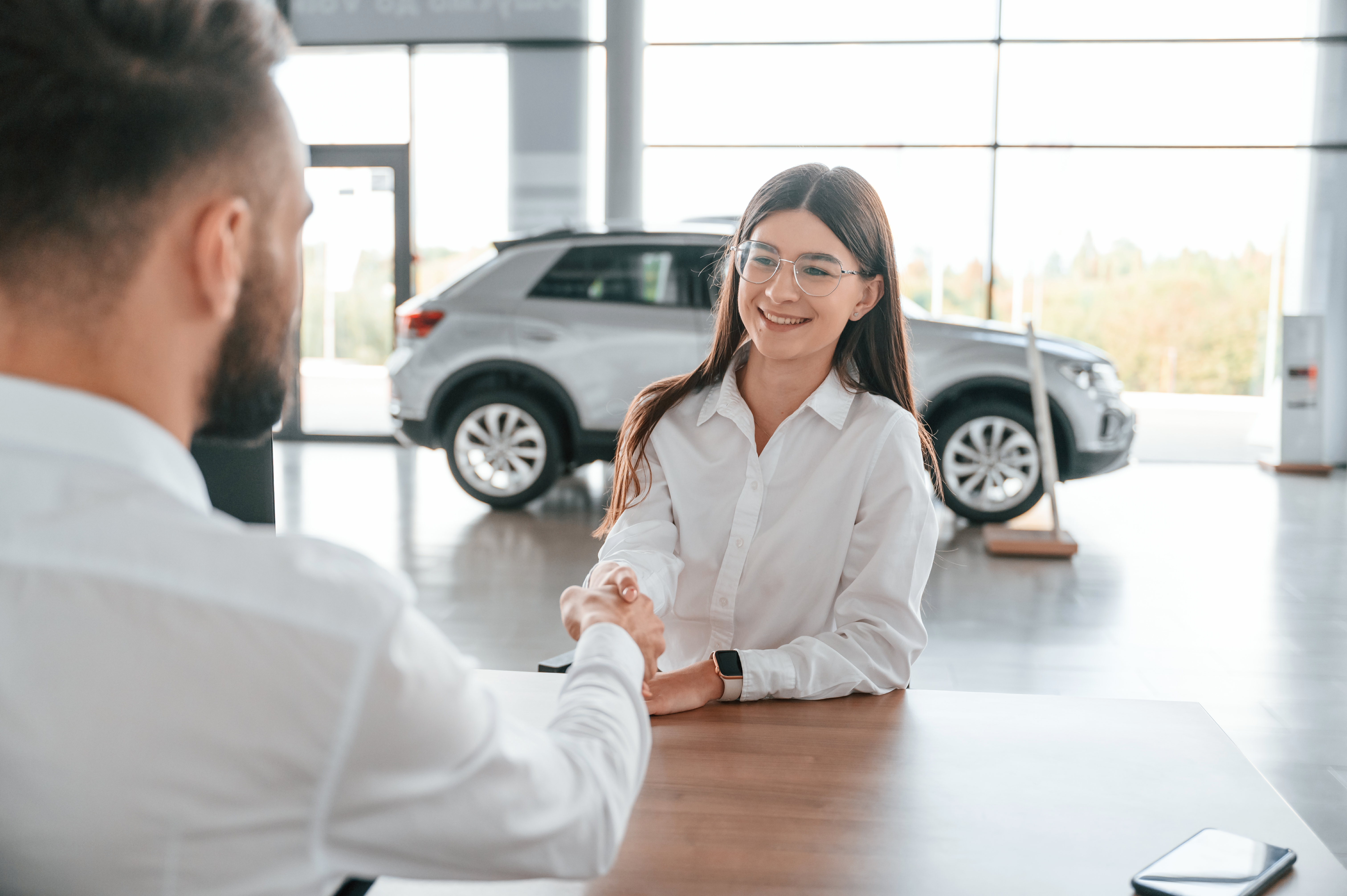 salesperson at car dealership