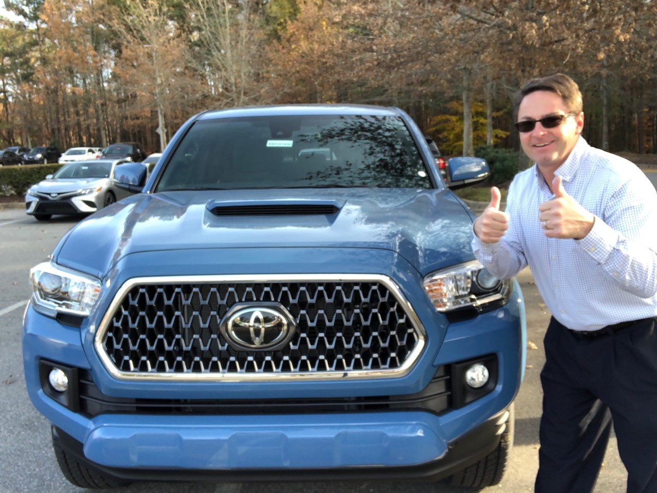 Toyota Jeff next to a tacoma 